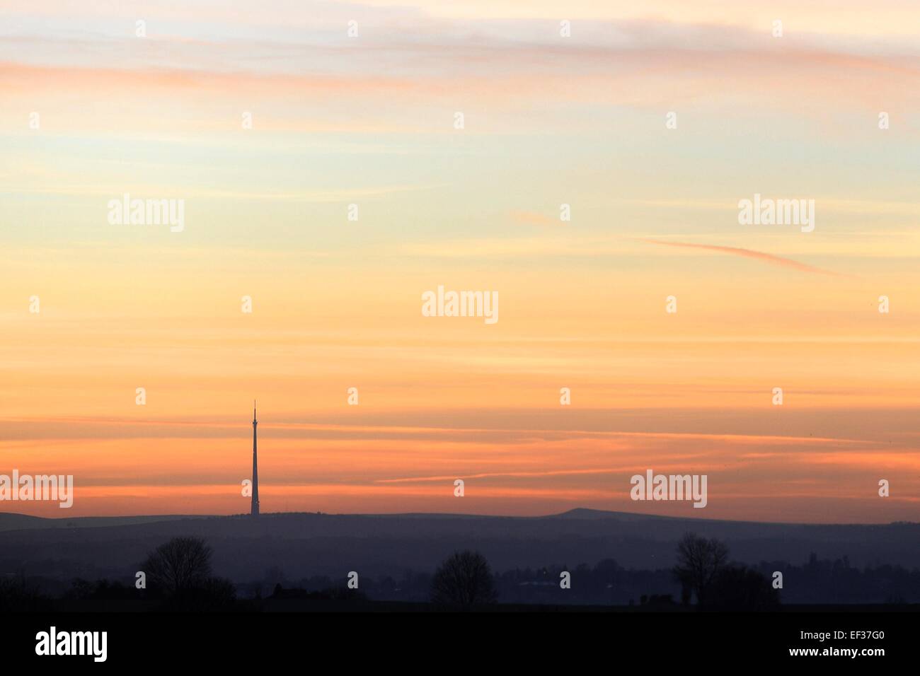 Emley Moor TV transmitter in West Yorkshire, England, which is now a Grade 1 listed building against a late January sunset Stock Photo