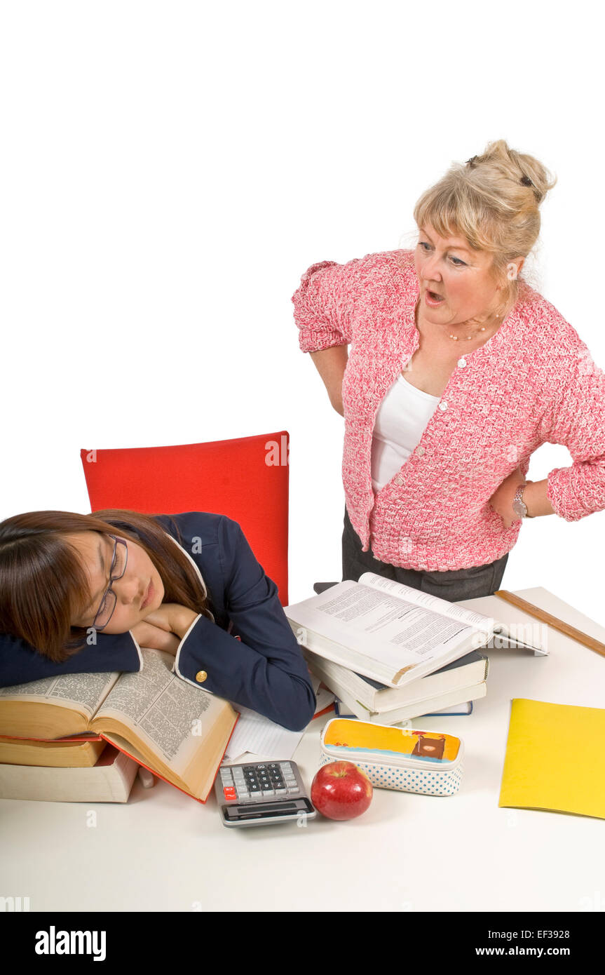 Frustrated teacher looking at sleeping student Stock Photo