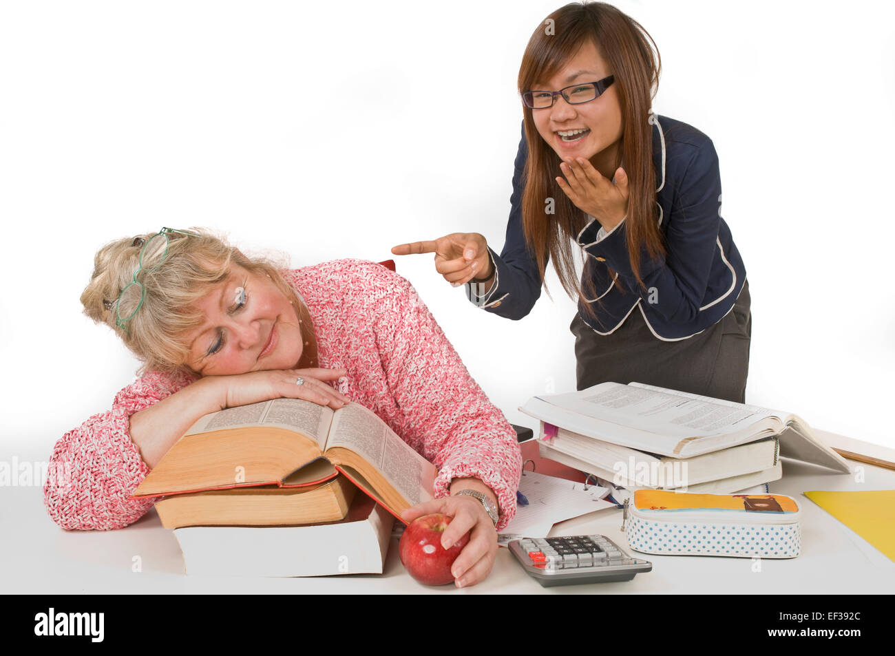 Student laughing at sleeping teacher Stock Photo