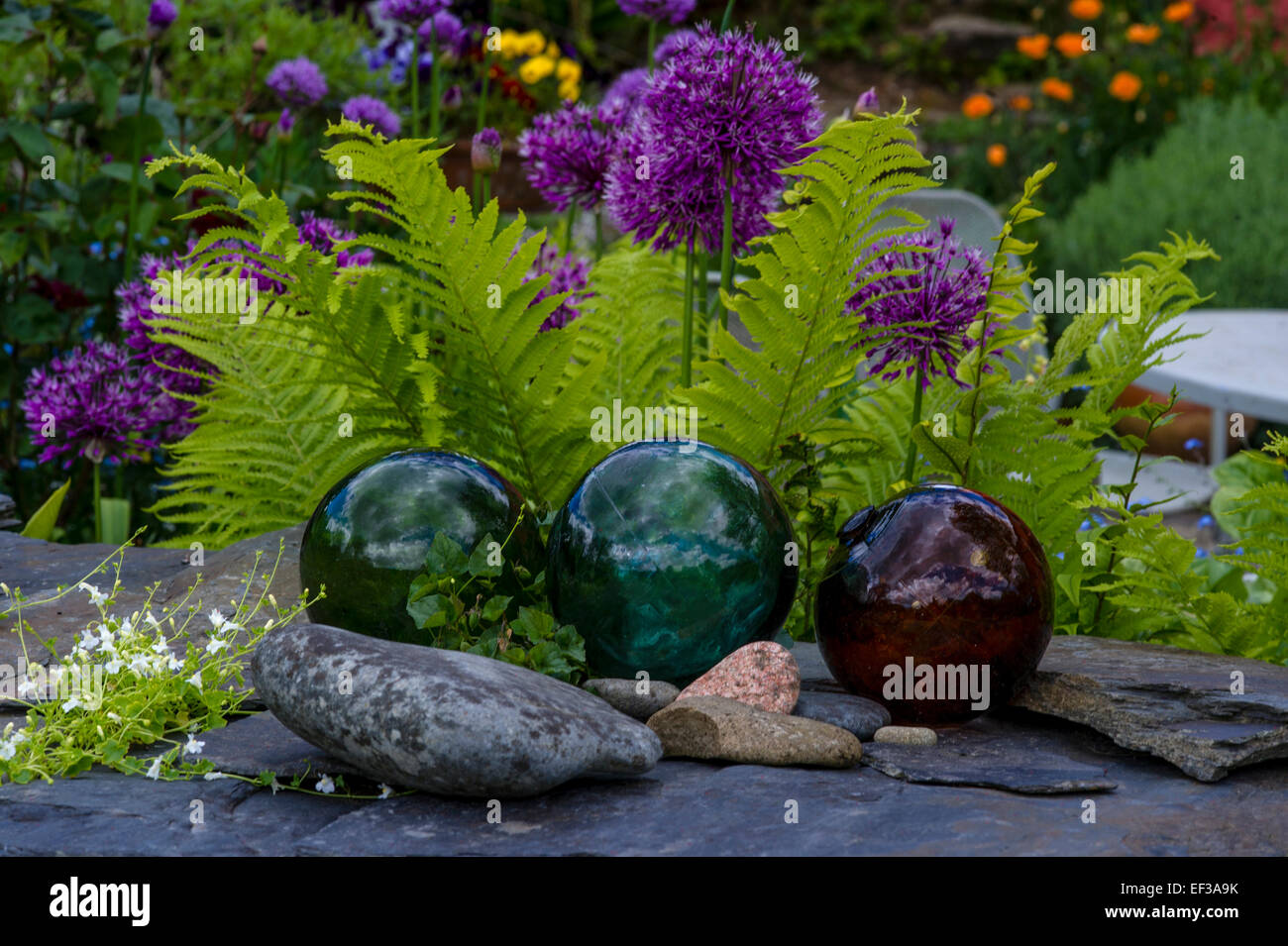 Glass spheres on garden wall in Front garden. Dyffryn Fernant, Fishguard,Pembrokeshire,South Wales Stock Photo