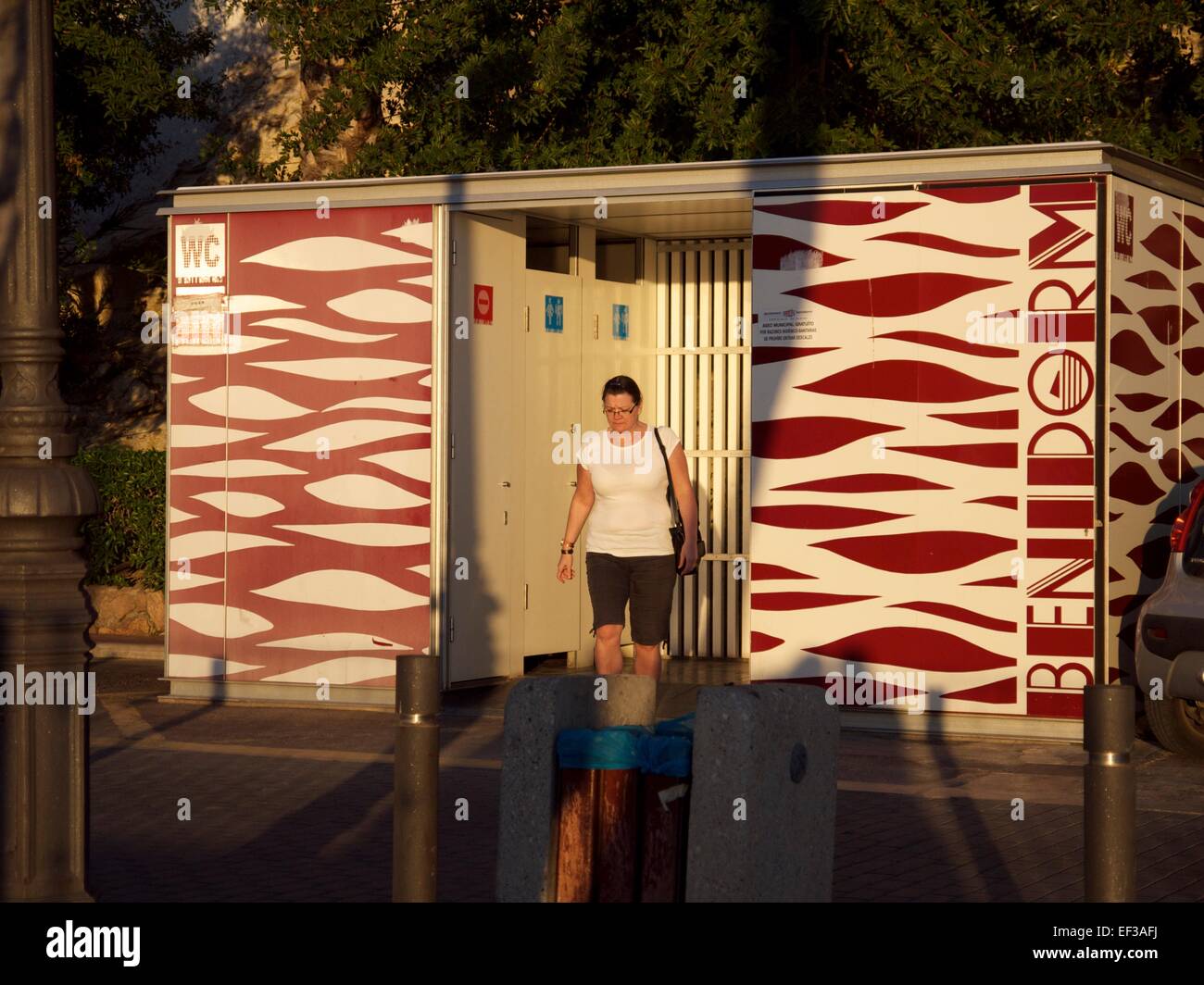 Lady coming out of a public toilet in Benidorm, Spain Stock Photo Alamy