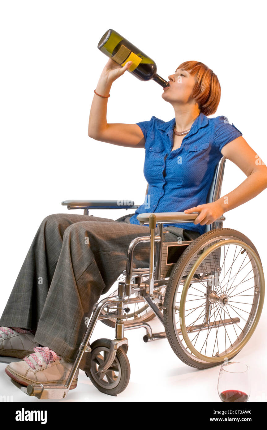 Woman in a wheelchair drinking wine from the bottle Stock Photo - Alamy