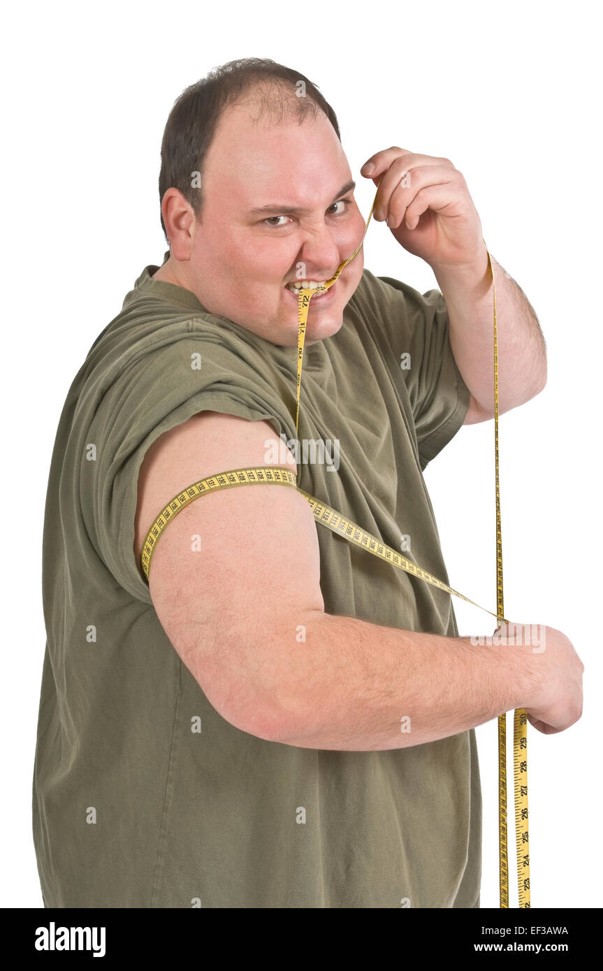 Overweight man measuring his bicep muscle Stock Photo