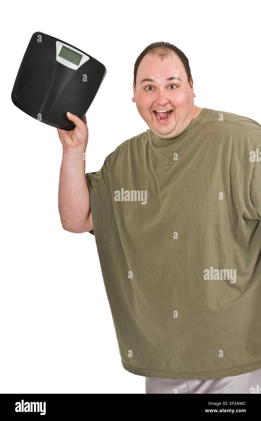 Overweight man holding a scale Stock Photo Alamy