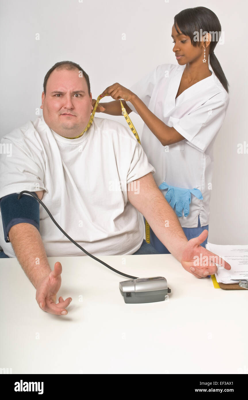 Nurse measuring patient's neck circumference Stock Photo Alamy