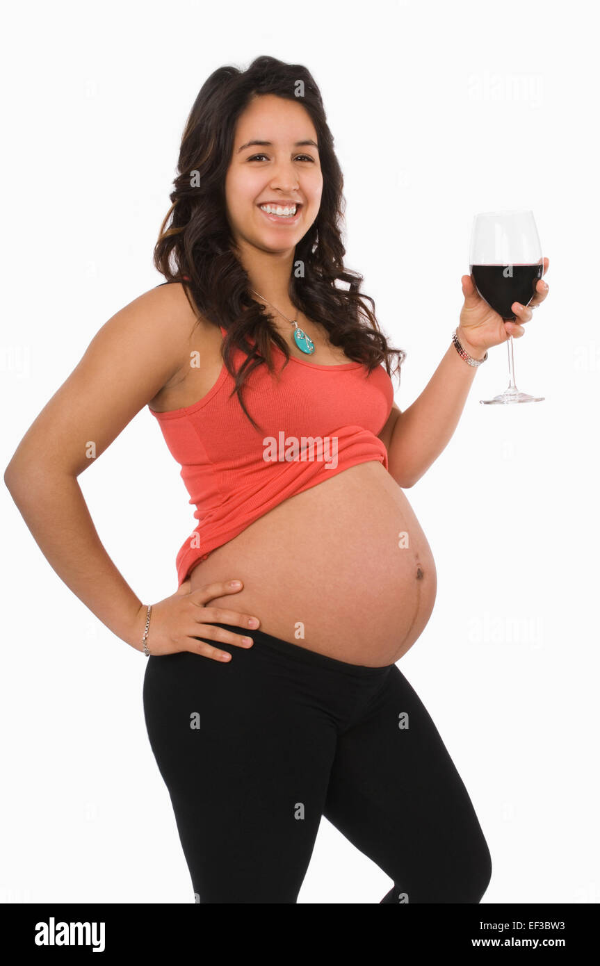 Pregnant woman drinking a glass of wine Stock Photo Alamy