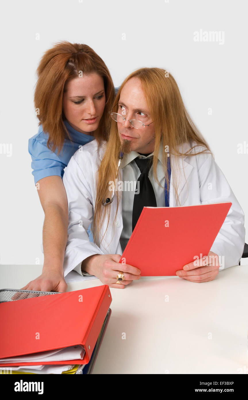 Male doctor flirting female nurse hires stock photography and images