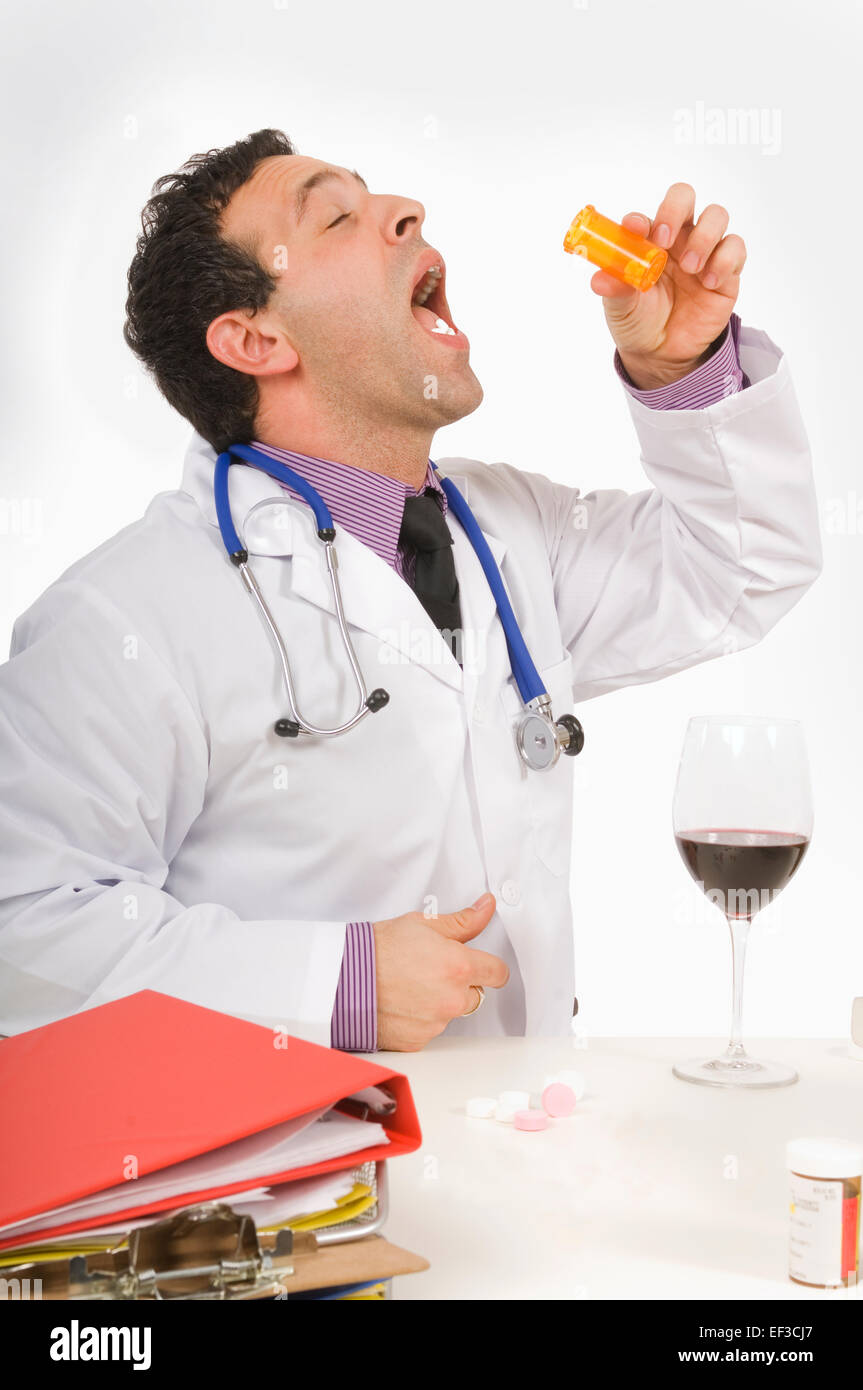 Doctor taking prescription medication Stock Photo
