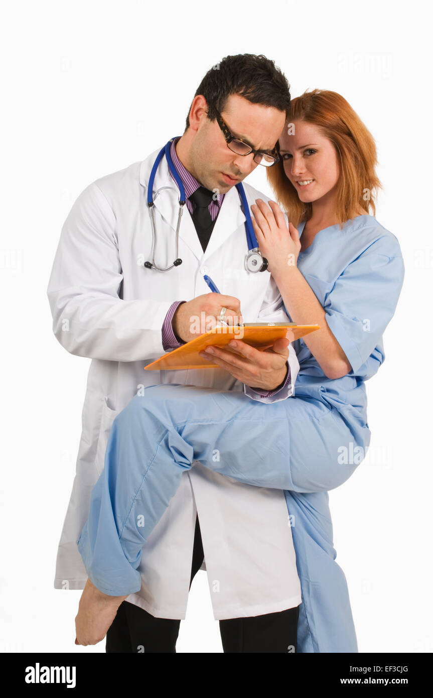 Male doctor flirting female nurse hires stock photography and images