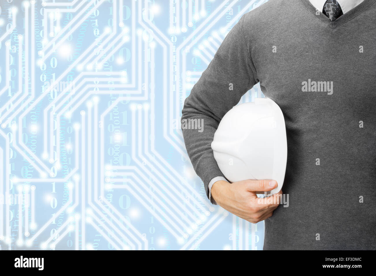 Engineer with pale blue digital circuit on pale blue background Stock Photo