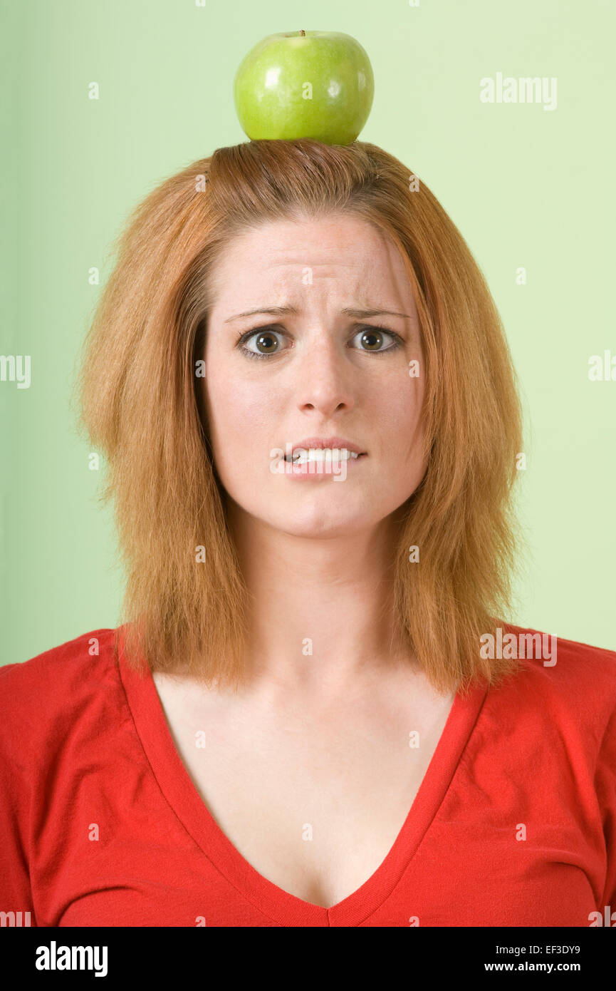Woman with an apple on her head Stock Photo Alamy