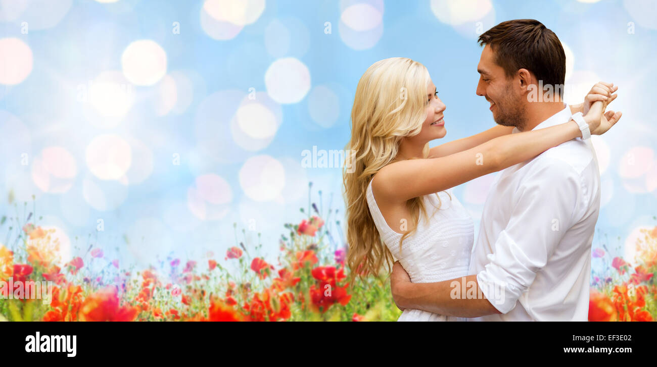 happy couple hugging over natural background Stock Photo - Alamy