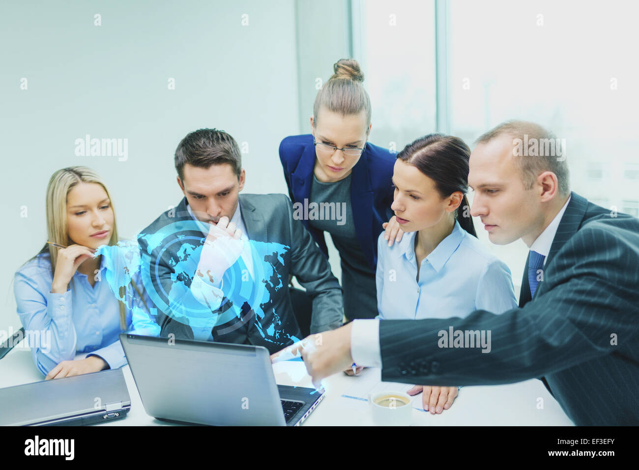 business team with laptop having discussion Stock Photo - Alamy