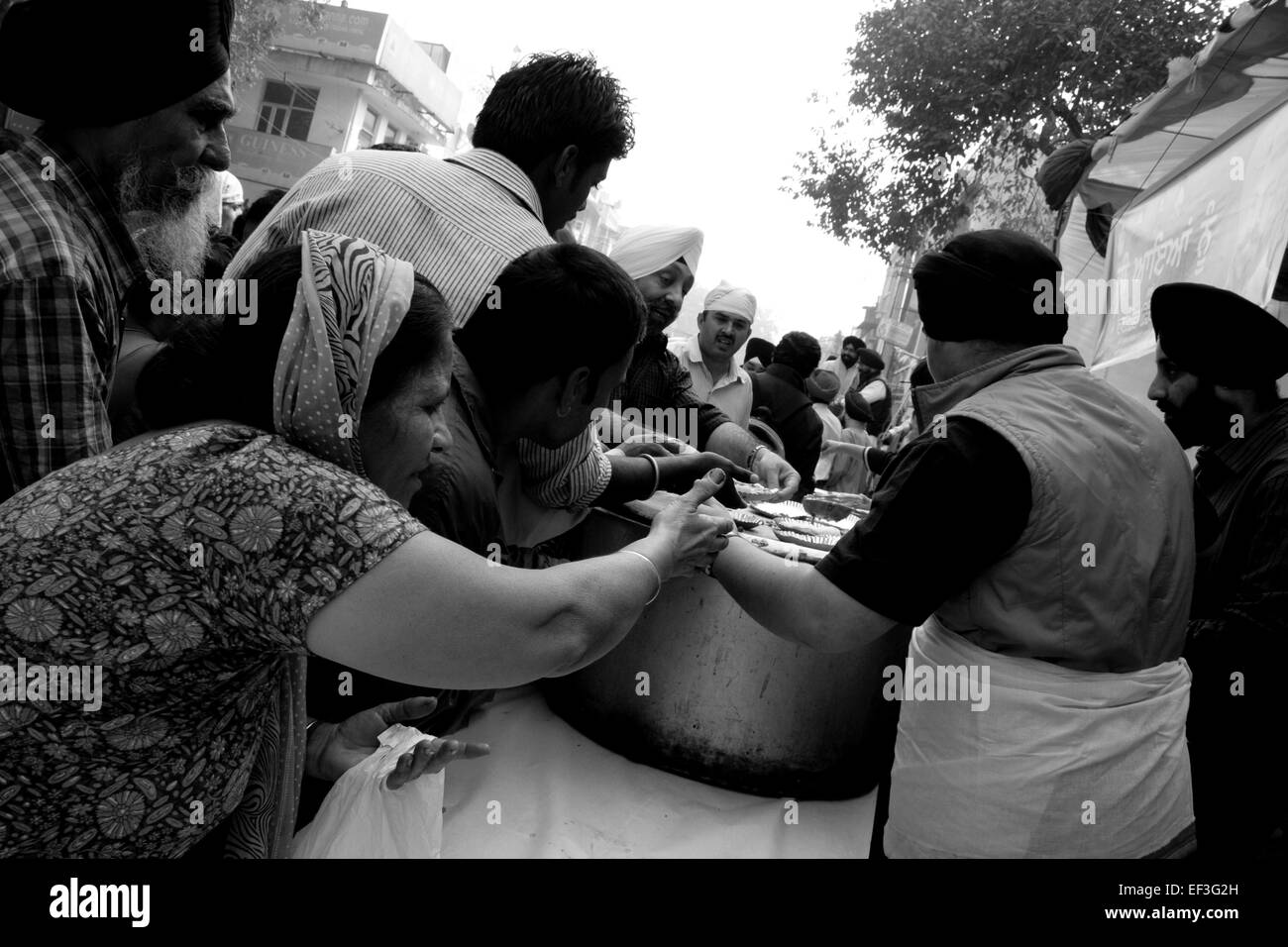 New Delhi, India - November 19, 2011: Sikh people celebrating Guru Nanak birth with a street parade and food distribution Stock Photo