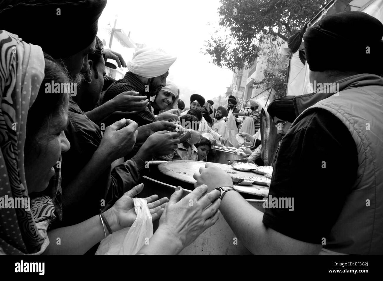 New Delhi, India - November 19, 2011: Sikh people celebrating Guru Nanak birth with a street parade and food distribution Stock Photo