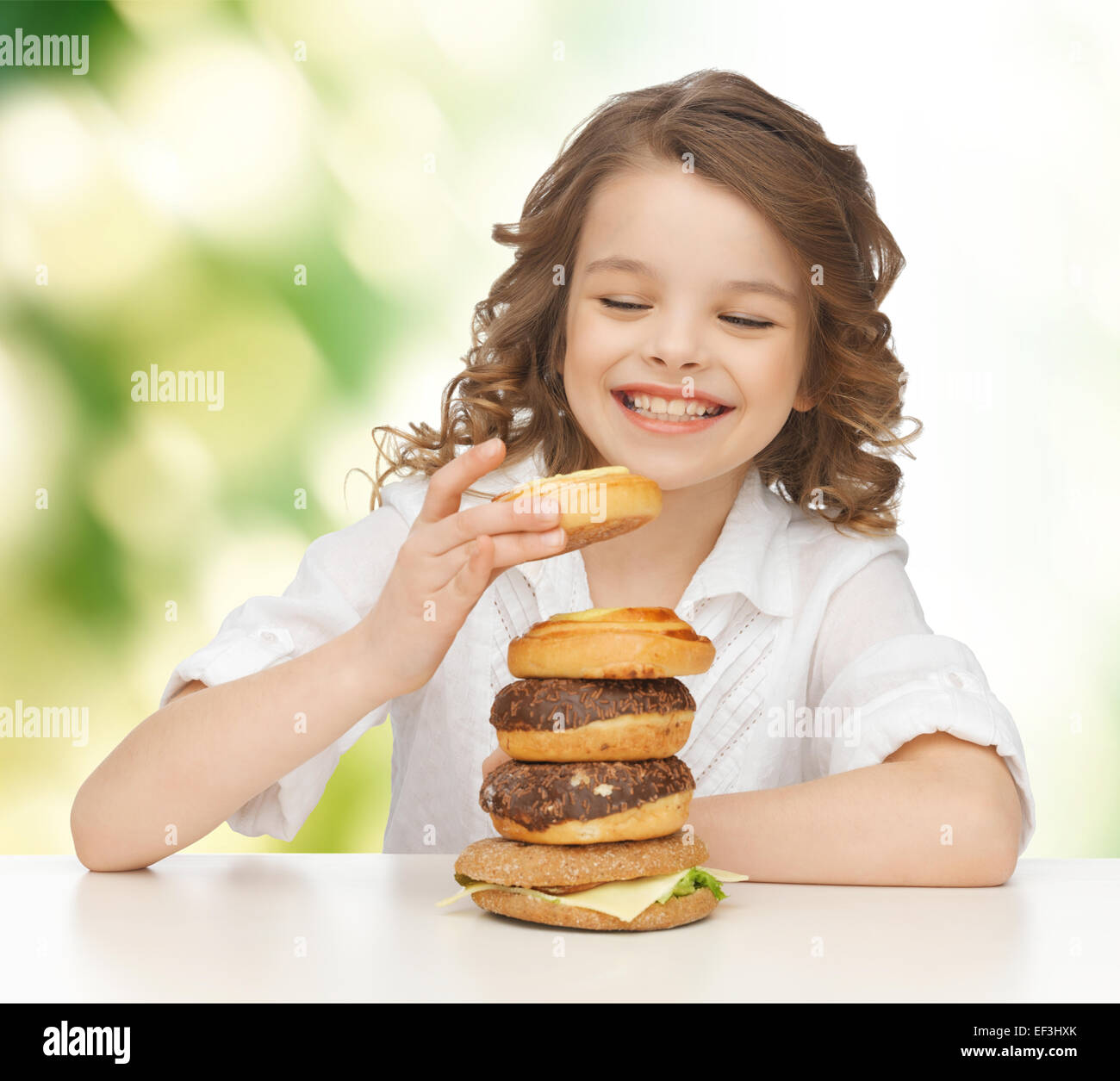 happy smiling girl with junk food Stock Photo - Alamy