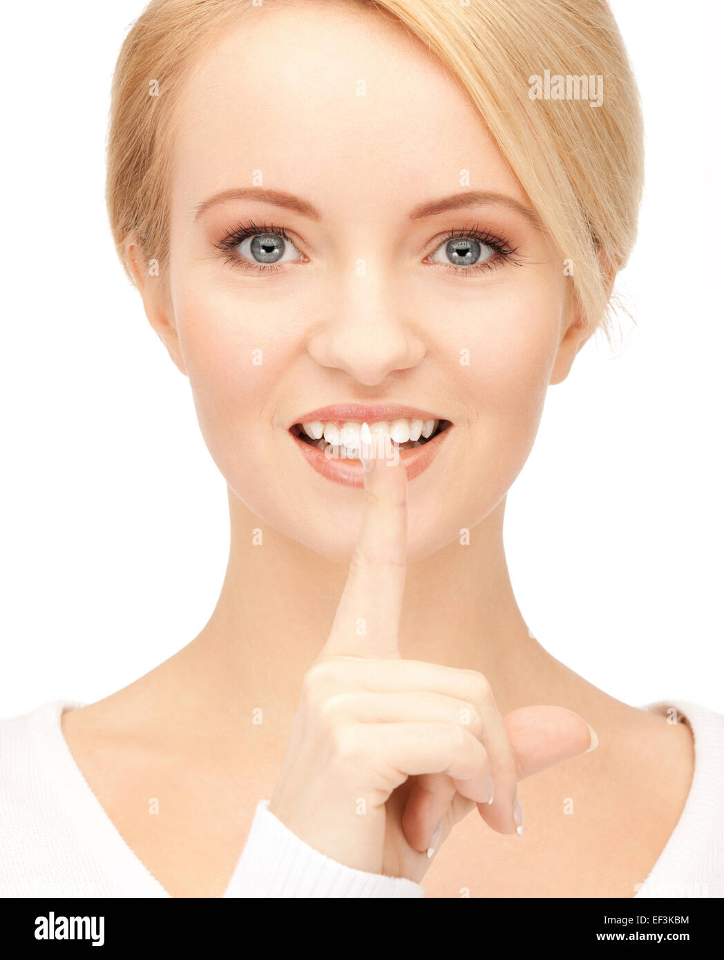 happy woman with finger on lips Stock Photo - Alamy