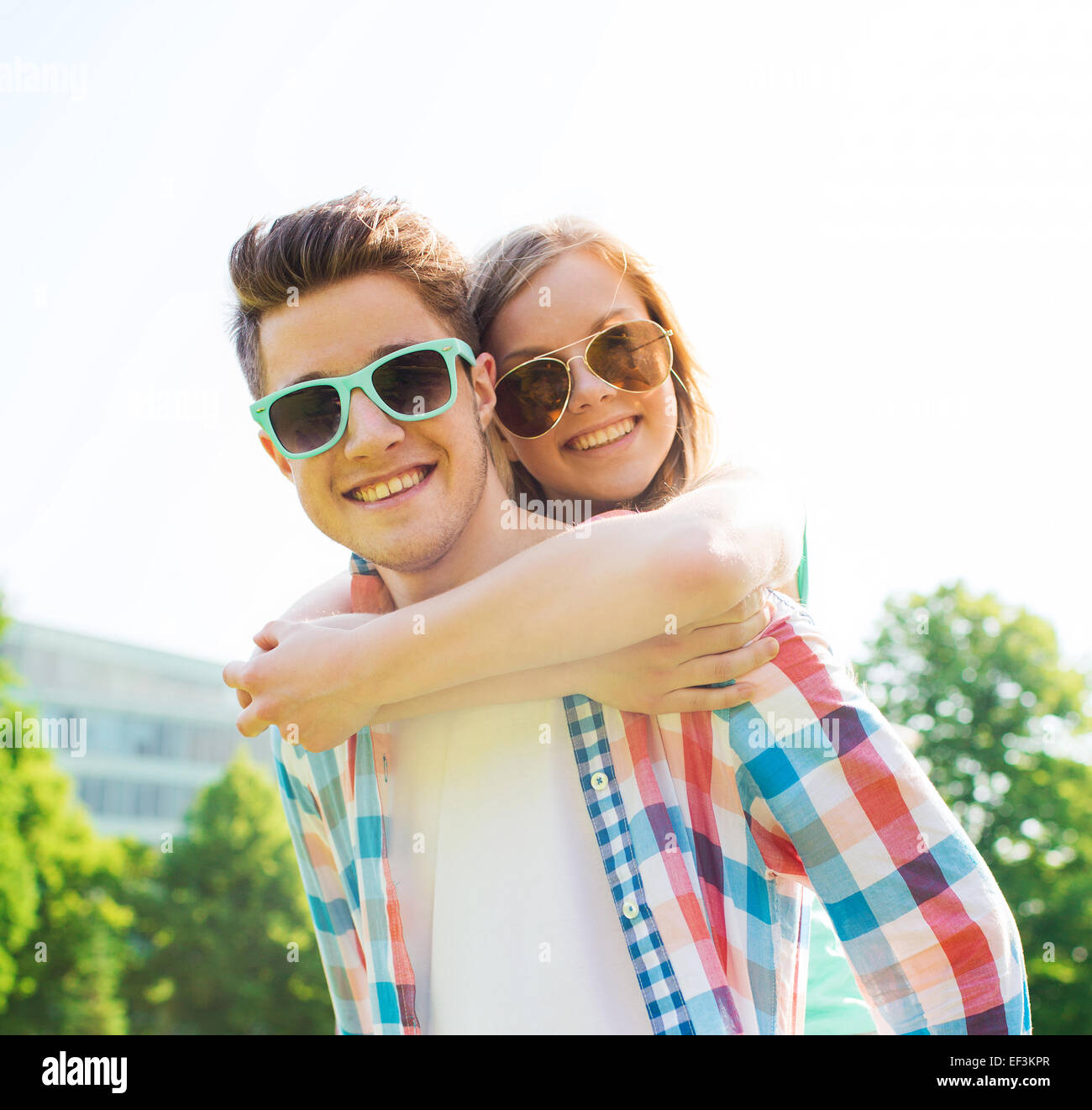 smiling couple having fun in park Stock Photo - Alamy