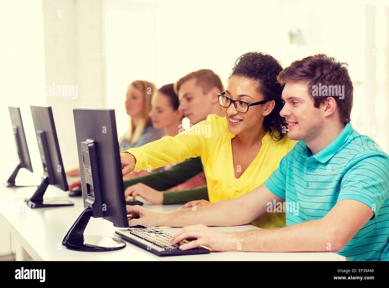 smiling students in computer class at school Stock Photo - Alamy
