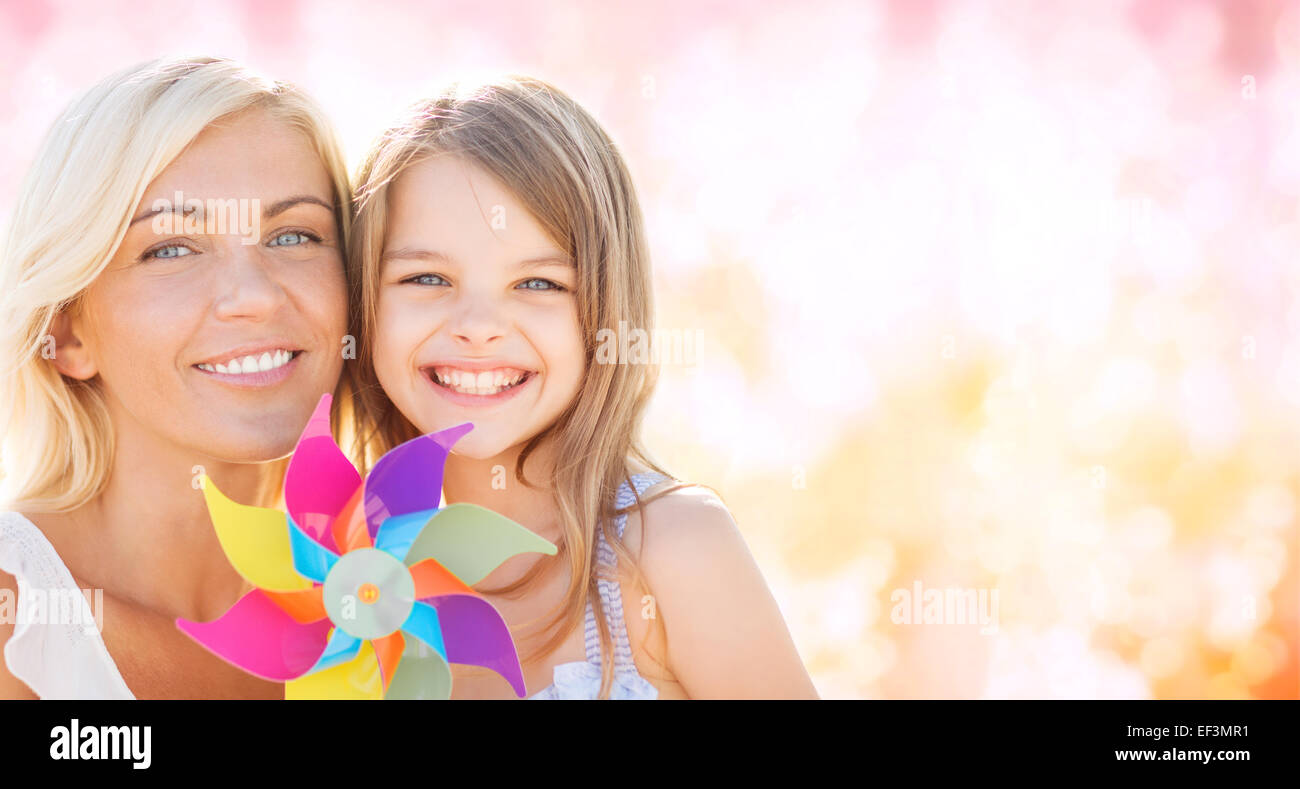 happy mother and little girl with pinwheel toy Stock Photo - Alamy