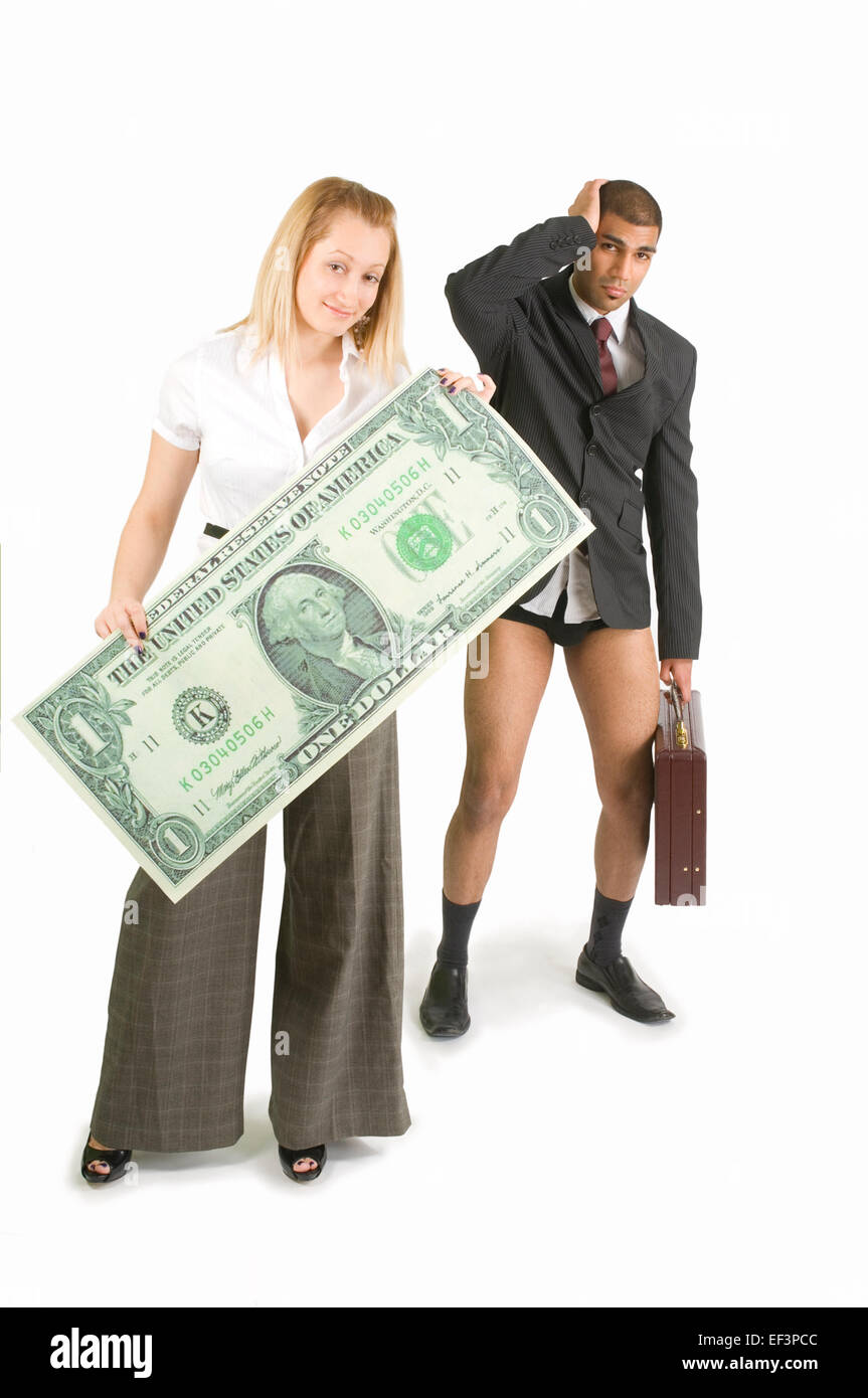Businesswoman holding oversized dollar bill in front of pant less businessman Stock Photo