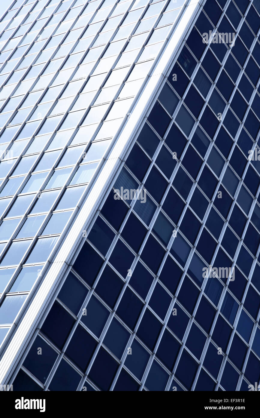 Windows of modern building toned in blue color Stock Photo - Alamy