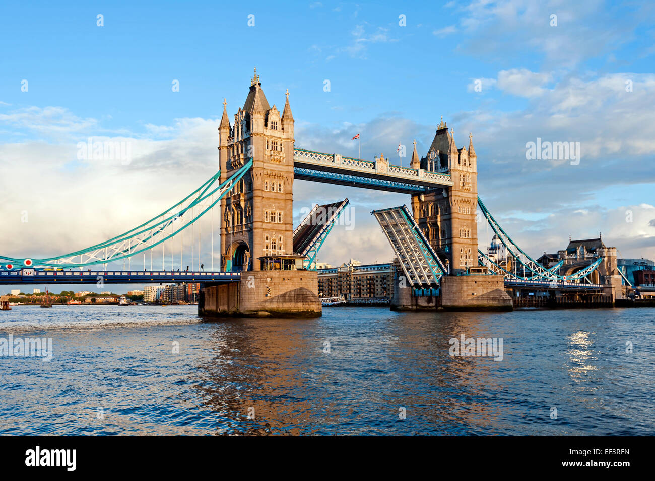 Open Tower Bridge over the River Thames on a sunny day, London, England,UK Stock Photo