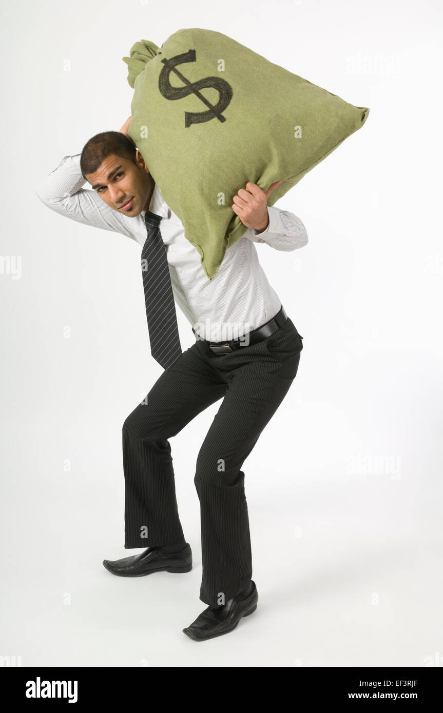 Man lifting a bag of money Stock Photo Alamy