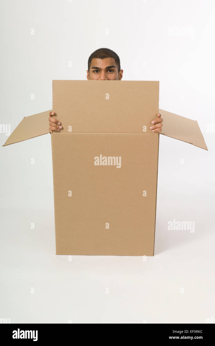 Man in a cardboard box Stock Photo Alamy