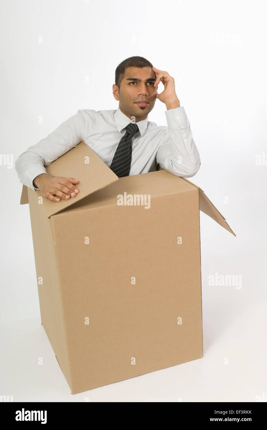 Man in a cardboard box Stock Photo Alamy