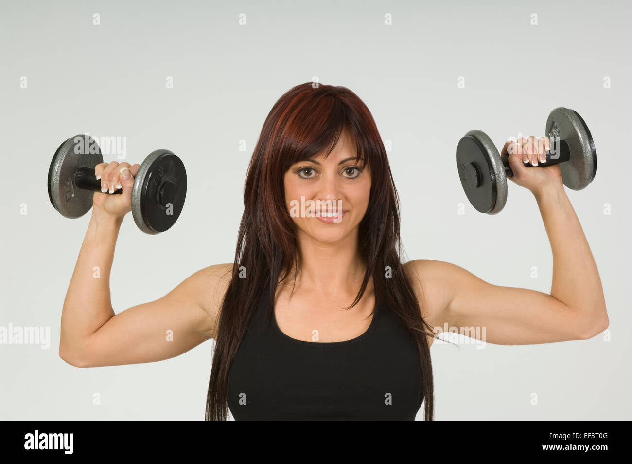 Woman lifting free weights Stock Photo Alamy