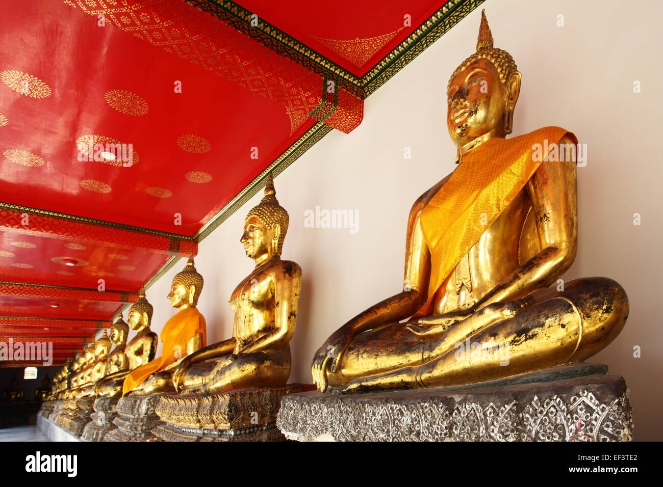 Gold statues of the Buddha abreast, Bangkok, Thailand Stock Photo