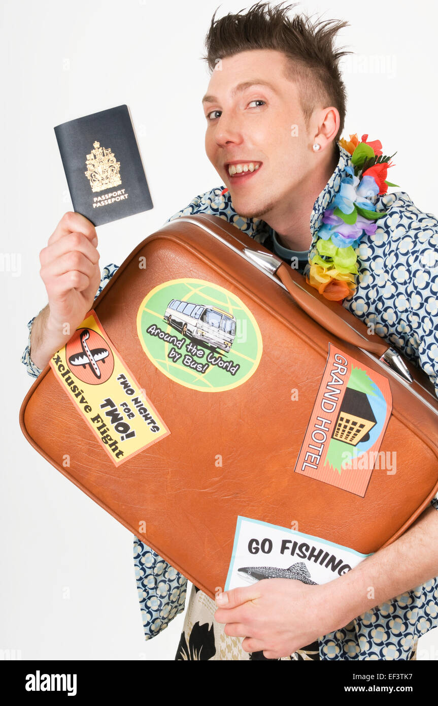 Man holding passport and suitcase Stock Photo