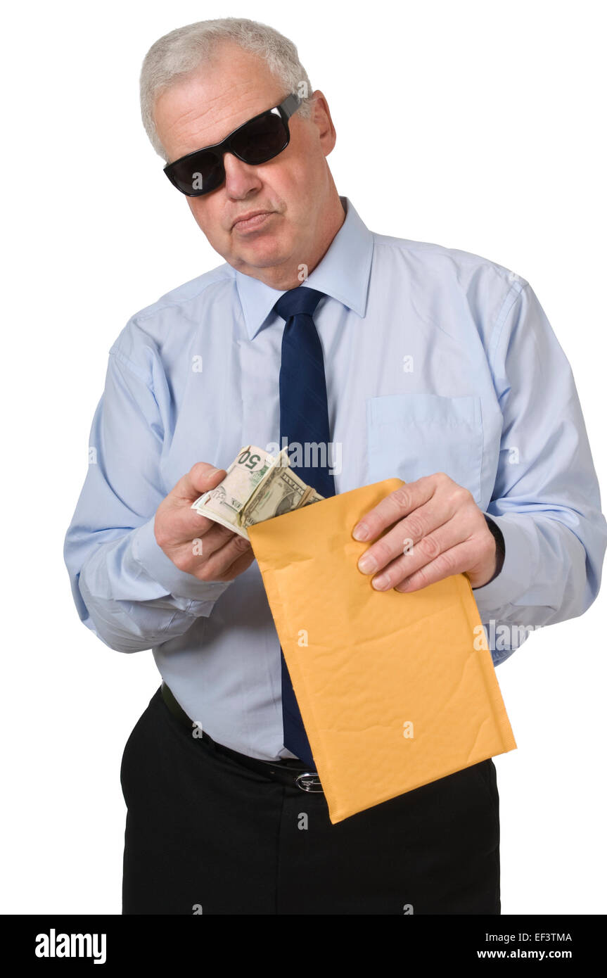 Businessman putting money in an envelope Stock Photo Alamy