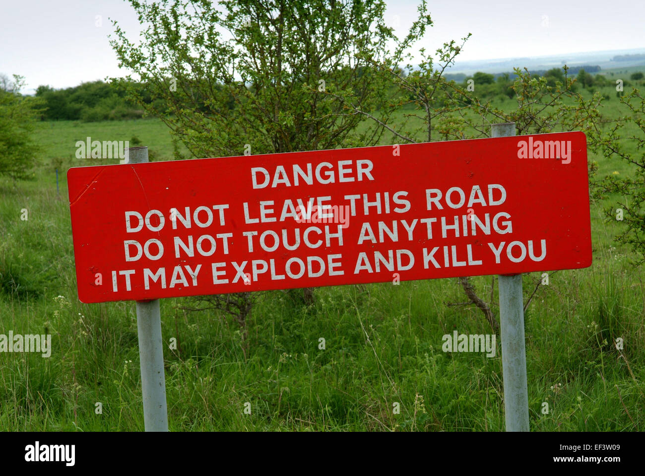 A warning sign of explosives in a restricted area of Salisbury Plain. Stock Photo