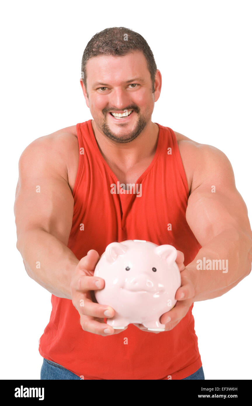 Muscular man holding piggy bank Stock Photo - Alamy