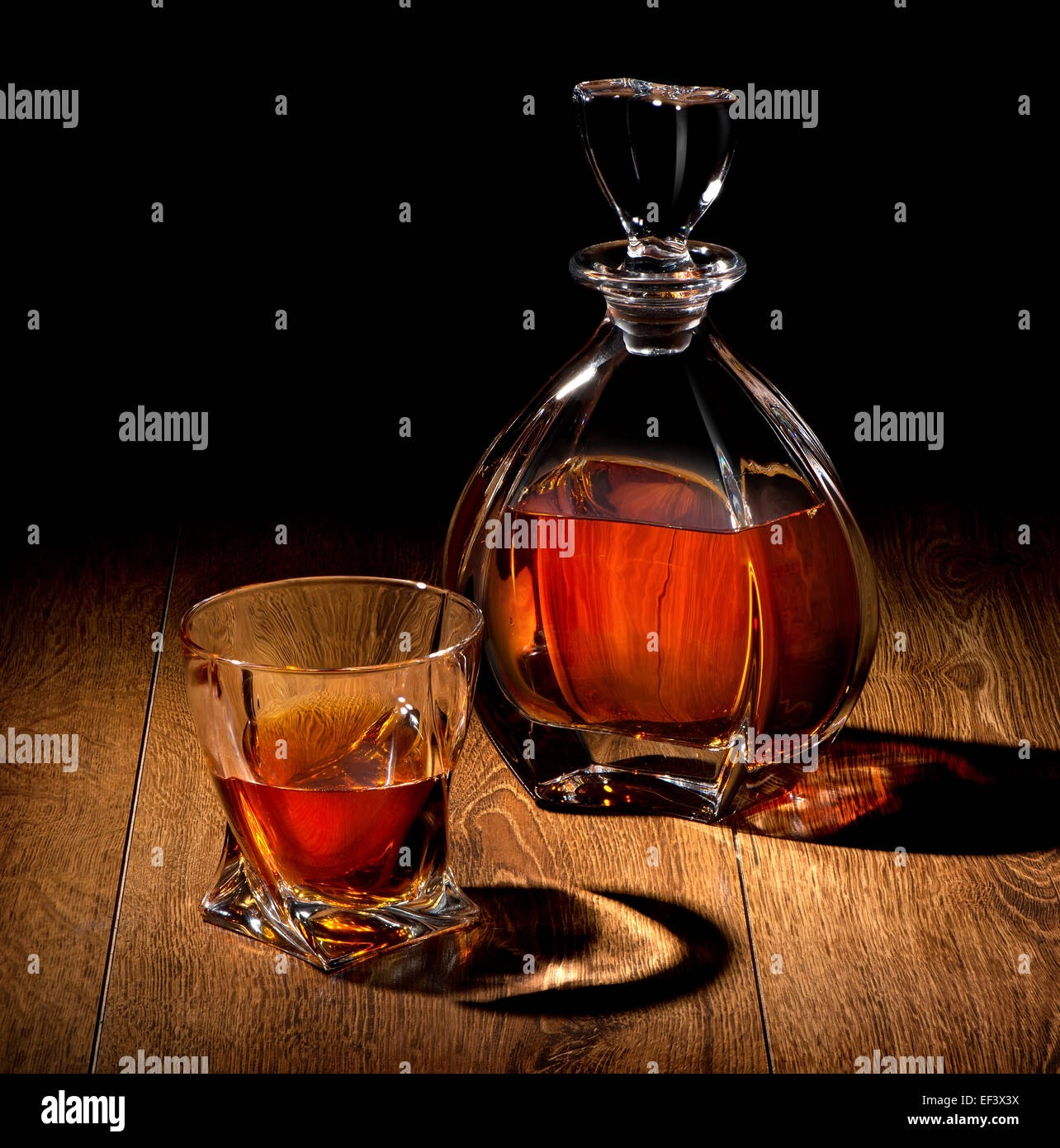 Whiskey on a wooden table on black background Stock Photo