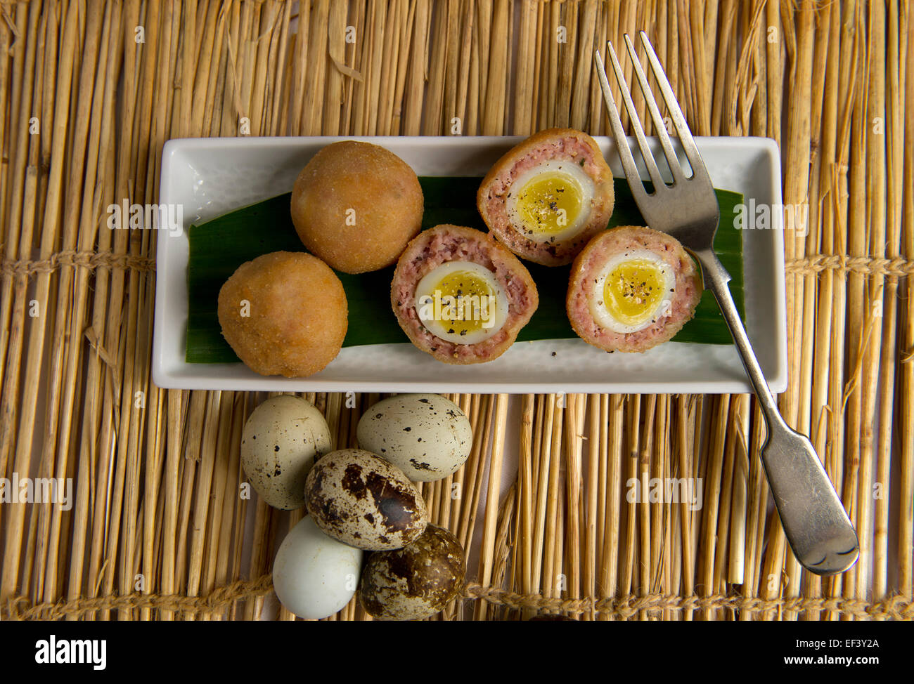 Scotch eggs make with quails eggs. a UK food foods delicacy delicacies