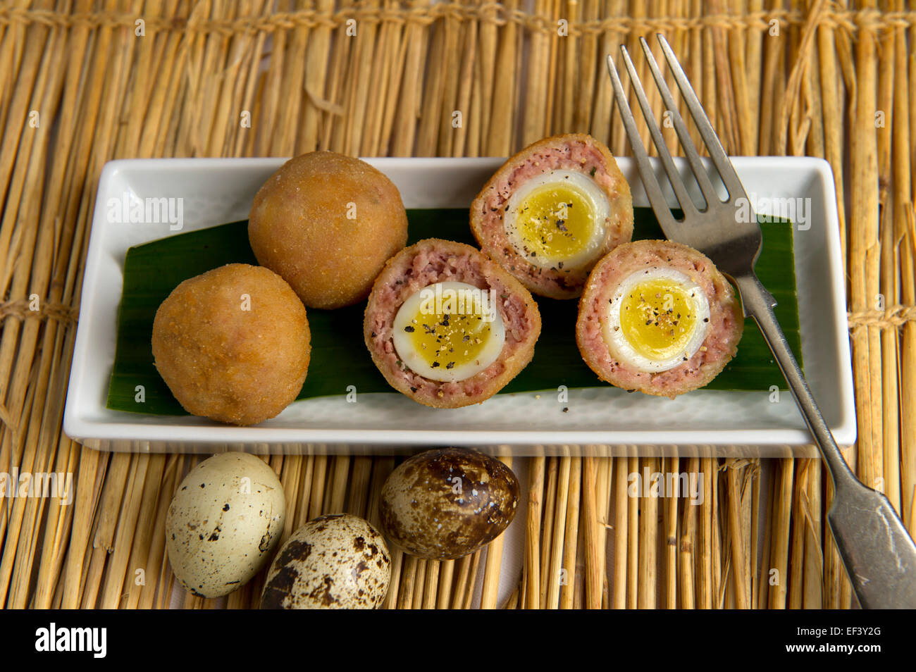 Scotch eggs make with quails eggs. a UK food foods delicacy delicacies