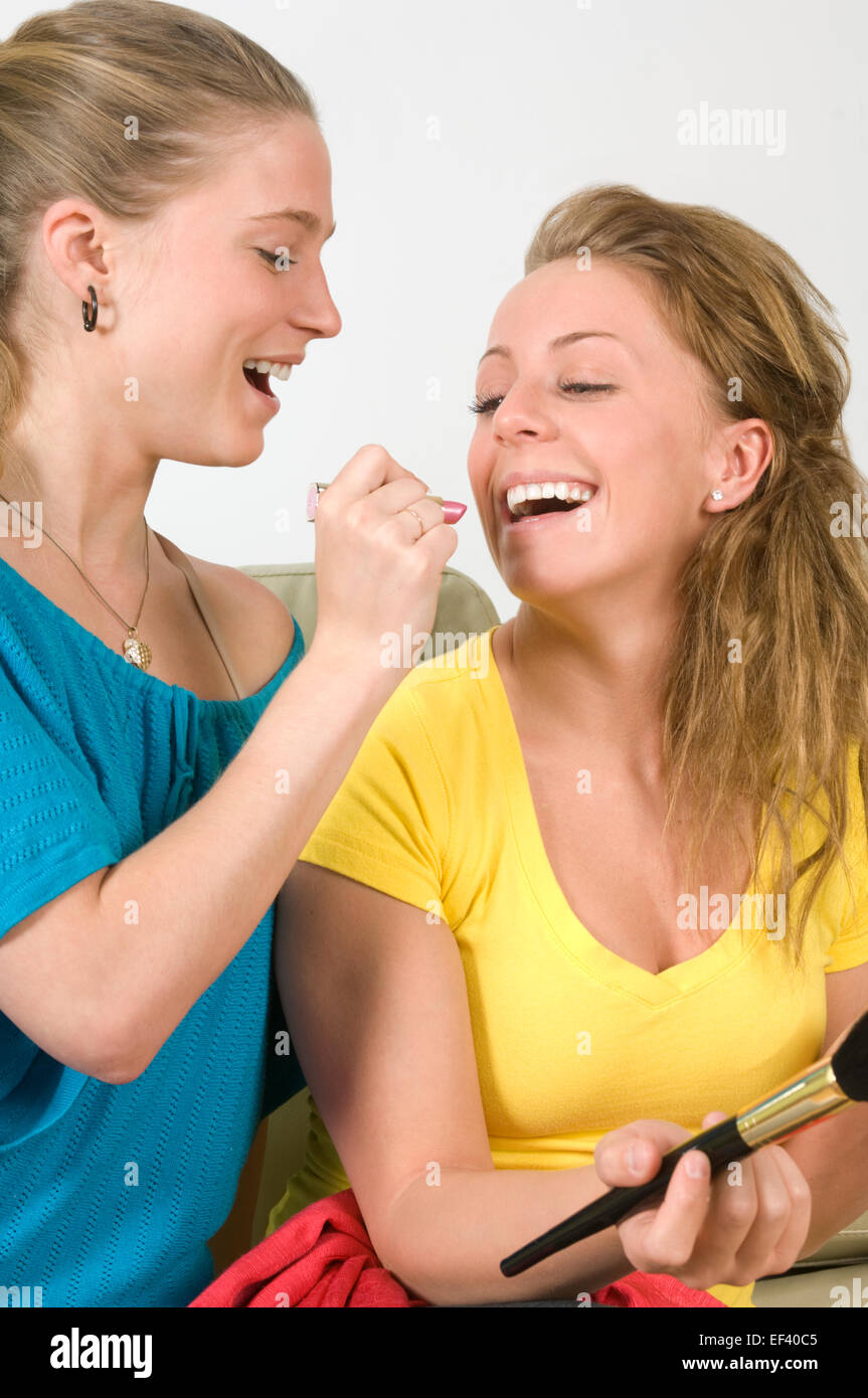 Women putting on make-up Stock Photo