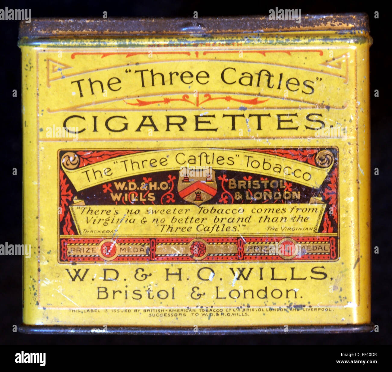 The front of The Three Castles cigarette tin, featuring a classic design.  This collectible tin displays iconic branding for a vintage tobacco product  Stock Photo