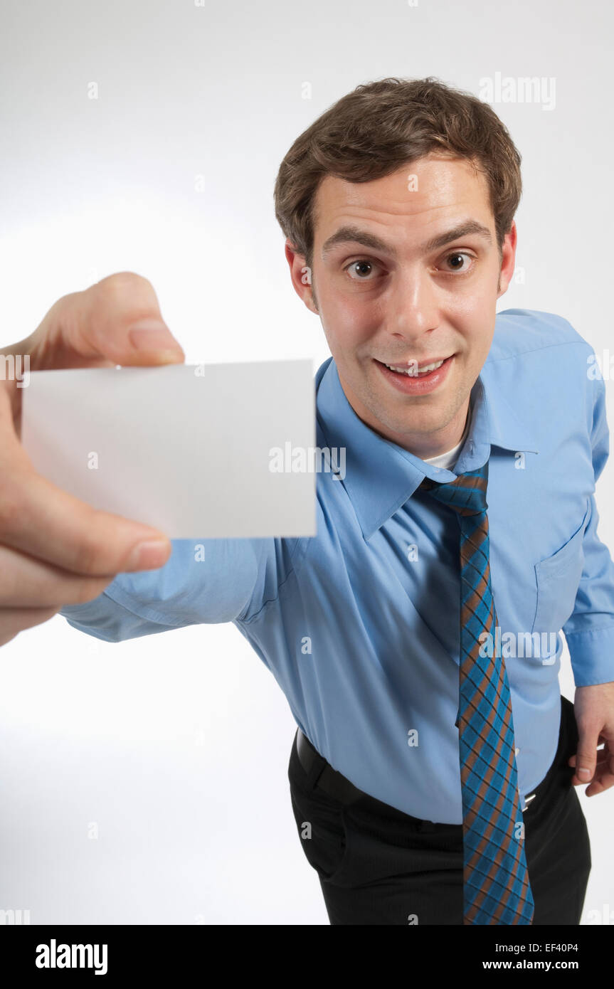 Businessman holding a blank business card Stock Photo