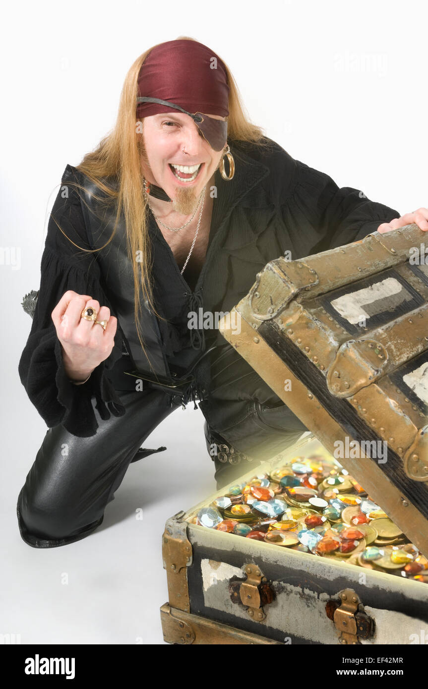Pirate opening up a treasure chest Stock Photo Alamy