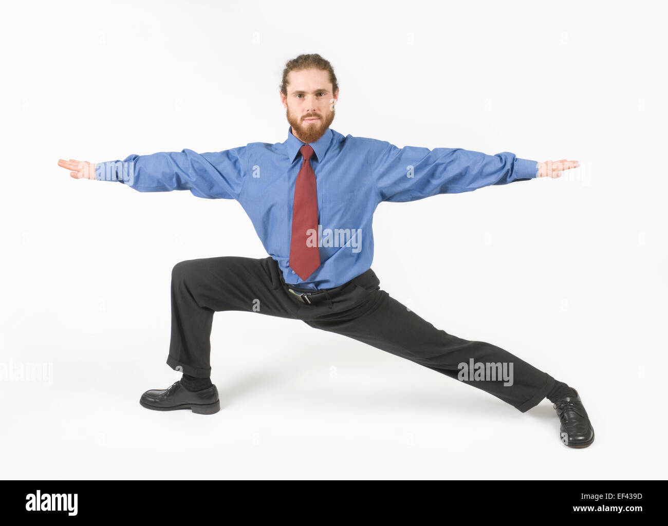 Businessman doing yoga Stock Photo - Alamy