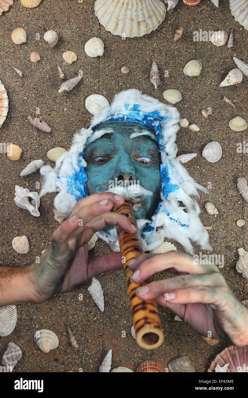 Blue sea man playing flute underwater Stock Photo Alamy