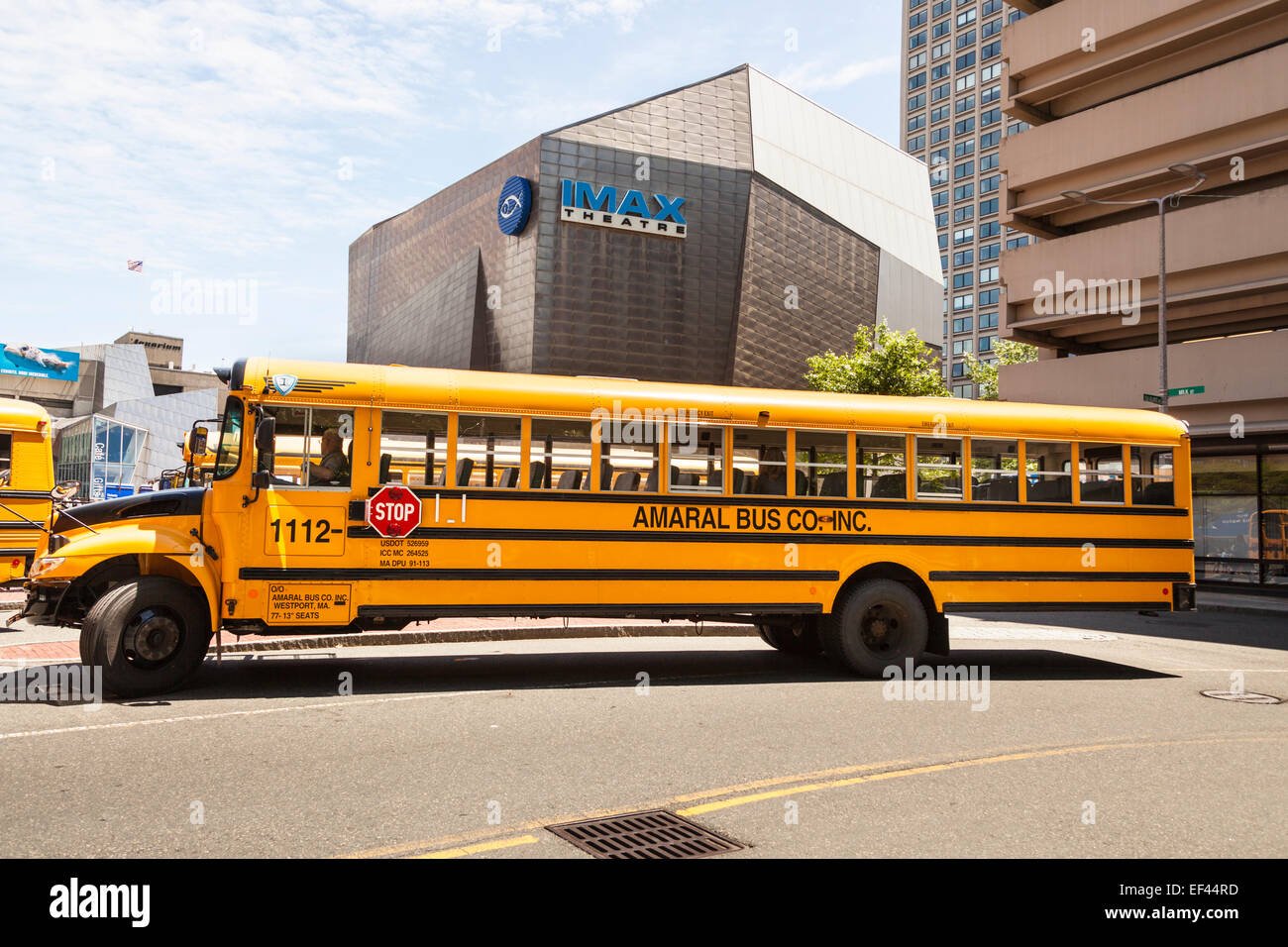 School bus parked outside the IMAX Theatre, Boston, Massachusetts, USA Stock Photo