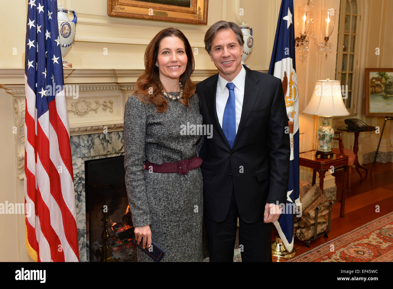 Antony Blinken and his wife, Assistant Secretary of State for Educational and Cultural Affairs Evan Ryan, smile before he was sworn in as the new Deputy Secretary of State by U.S. Secretary of State John Kerry, at the U.S. Department of State in Washington, D.C., on January 9, 2015. Stock Photo