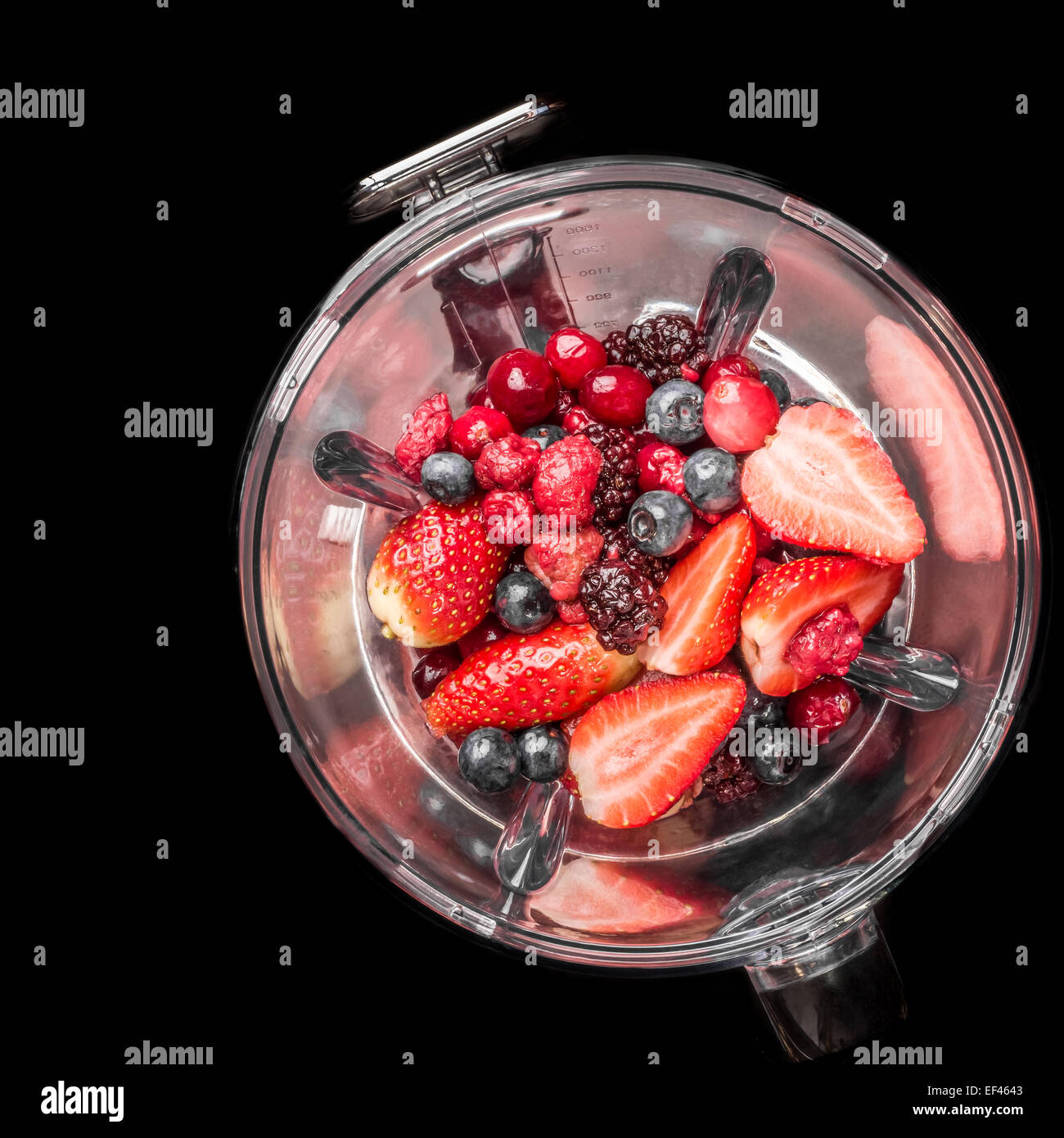 Mixed berries in a blender viewed from the top. Stock Photo