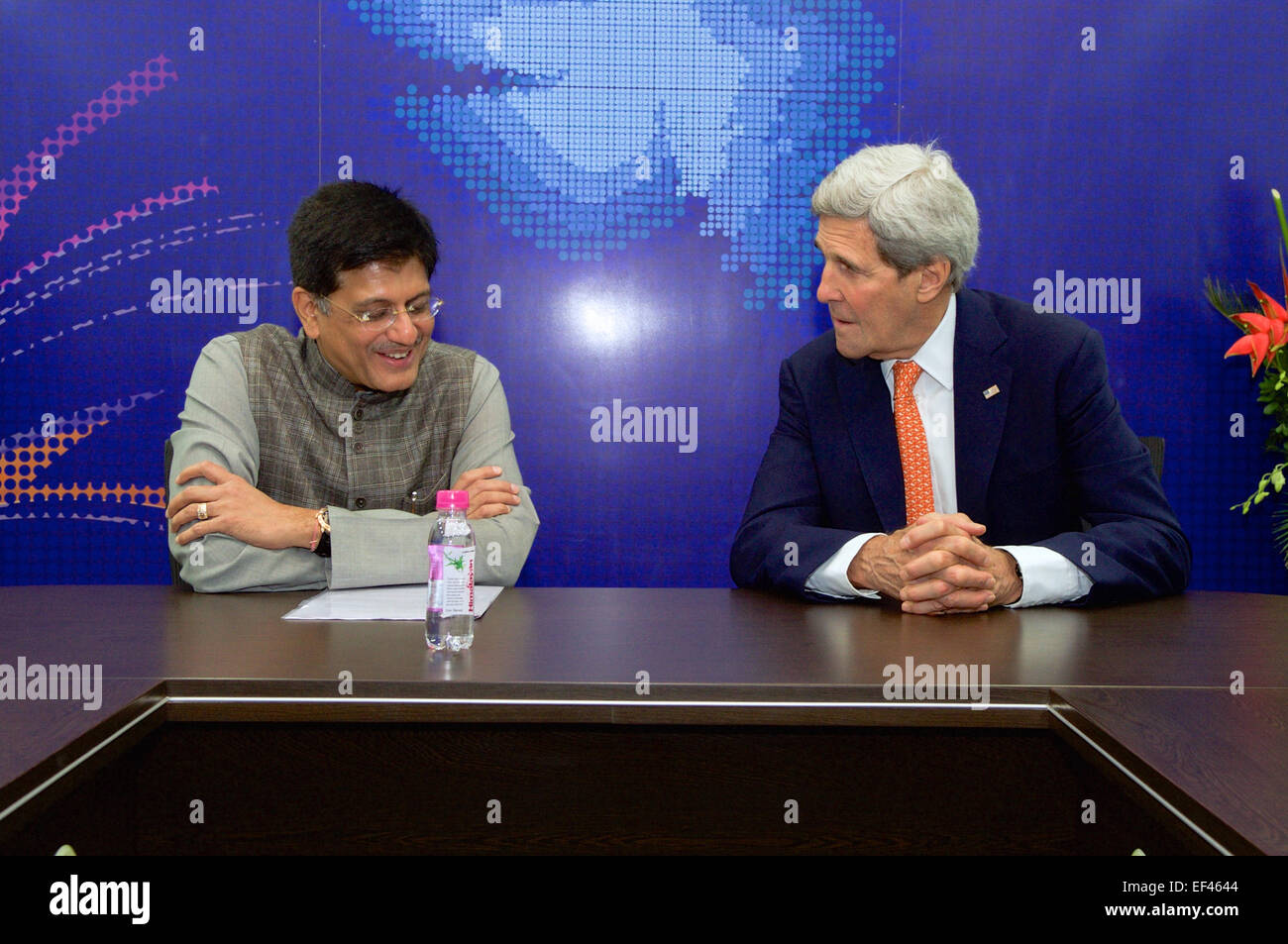 U.S. Secretary of State John Kerry sits with Indian Energy Minister