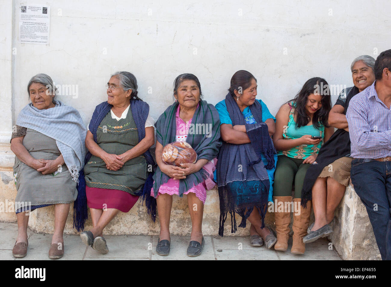 San Sebastian Abasolo, Oaxaca, Mexico - Women wait for mass to begin outside San Sebastian Abasolo Catholic church. Stock Photo